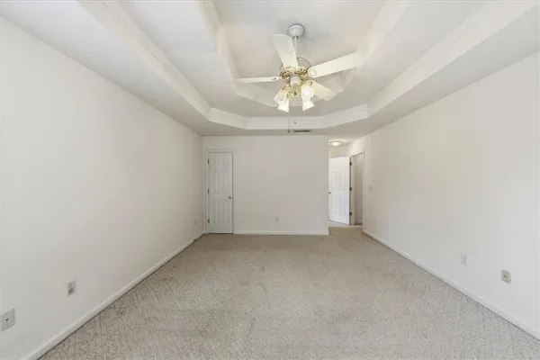 a bathroom with a tub a sink and a large mirror