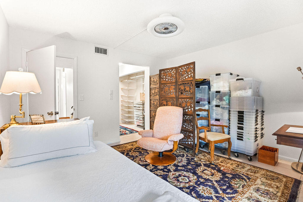 2520 Presidential Way, Unit 203 West Palm Beach, FL 33401 - Photo 16 of 27 a living room with furniture rug and wooden floor