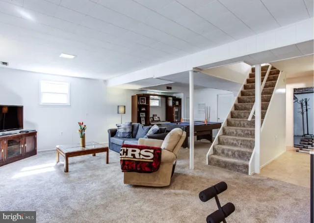 a bedroom with a bed and a television