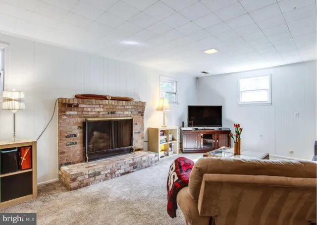 a room with pool table and windows