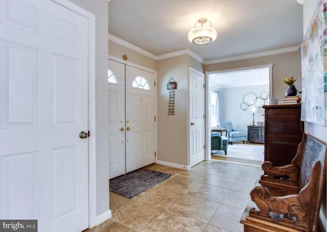 a living room with furniture a dining table and a stove