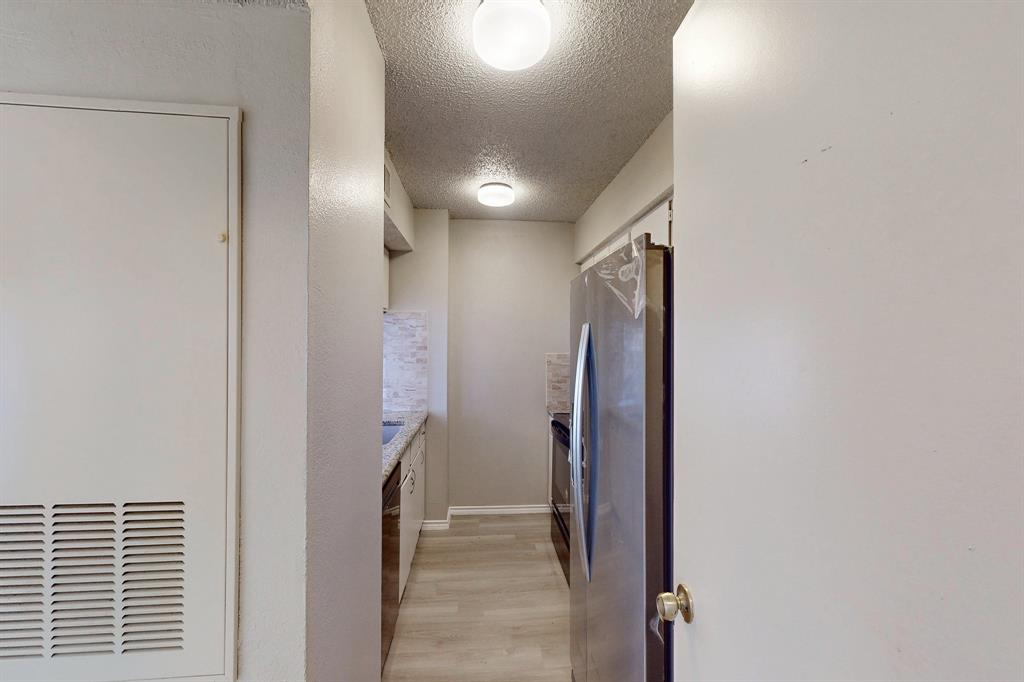 12484 Abrams Road, Unit 2121 Dallas, TX 75243 - Photo 11 of 27 a view of a hallway with a elevator