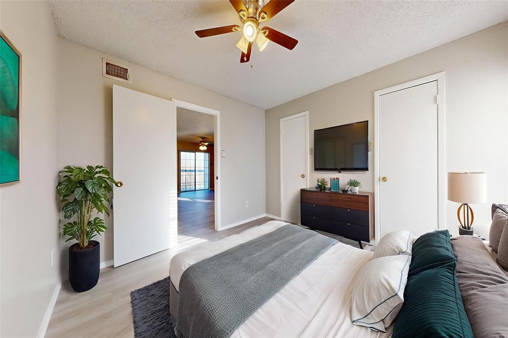 12484 Abrams Road, Unit 2121 Dallas, TX 75243 - Photo 14 of 27 a bedroom with a bed television and a couch