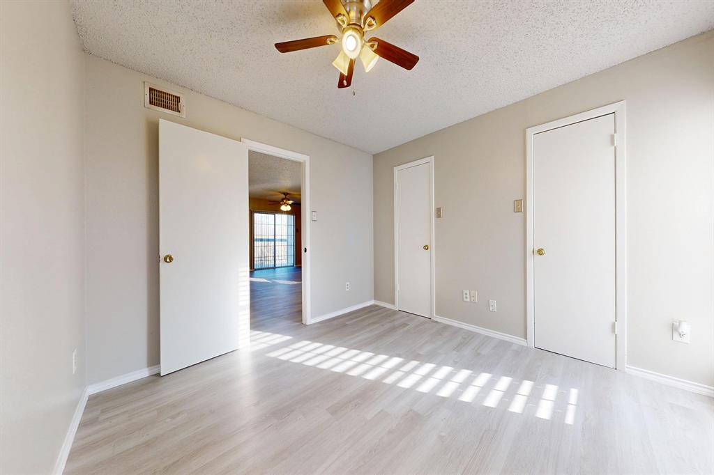 12484 Abrams Road, Unit 2121 Dallas, TX 75243 - Photo 16 of 27 a view of an empty room with window and a ceiling fan