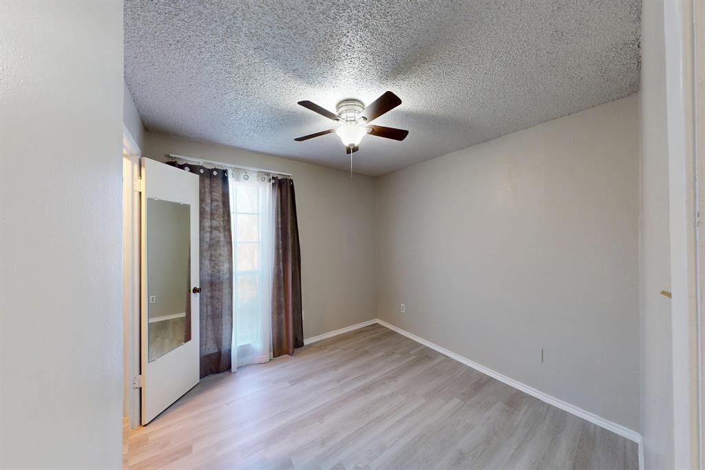 12484 Abrams Road, Unit 2121 Dallas, TX 75243 - Photo 20 of 27 a view of an empty room with a window