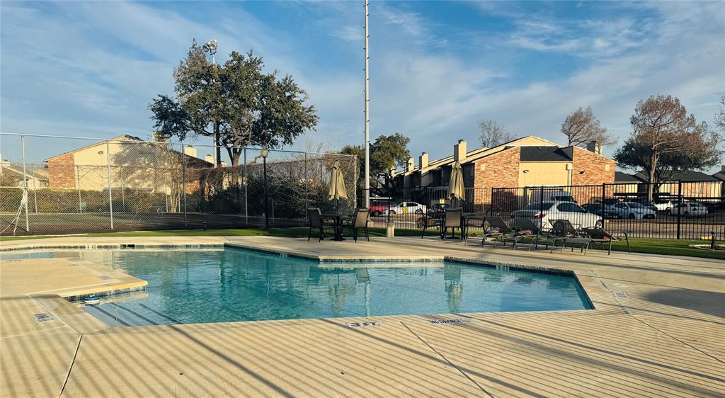 12484 Abrams Road, Unit 2121 Dallas, TX 75243 - Photo 26 of 27 a view of a swimming pool with a lounge chairs