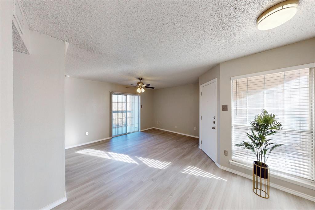 12484 Abrams Road, Unit 2121 Dallas, TX 75243 - Photo 8 of 27 an empty room with windows and plants