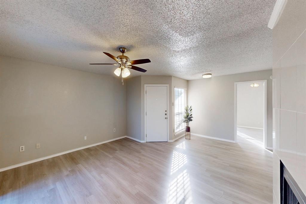 12484 Abrams Road, Unit 2121 Dallas, TX 75243 - Photo 9 of 27 a view of empty room with wooden floor
