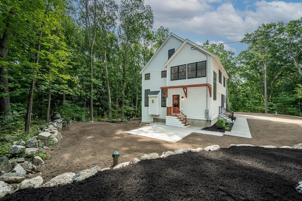 5 Tucker Road Andover, MA 01810 - Photo 35 of 42 a view of a house with backyard and trees