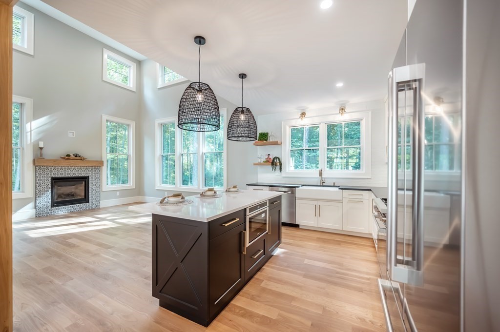 5 Tucker Road Andover, MA 01810 - Photo 4 of 42 a kitchen with a sink and a wooden floor