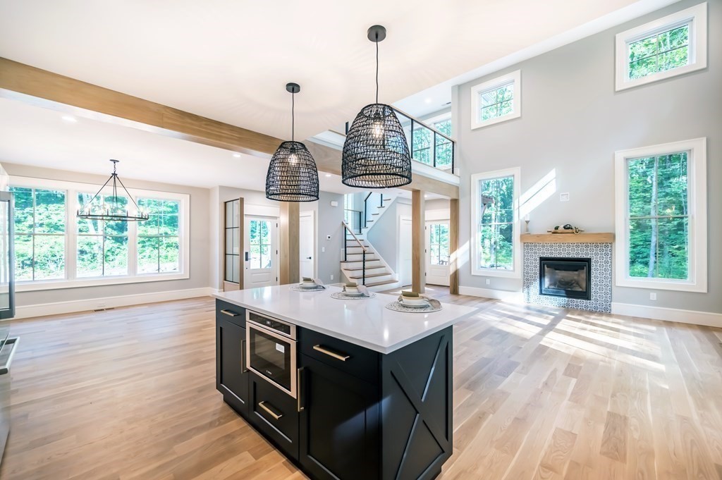 5 Tucker Road Andover, MA 01810 - Photo 8 of 42 a view of kitchen and living room with wooden floor
