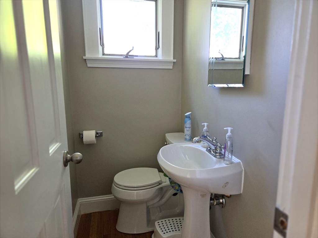 25 Waldeck Road Milton, MA 02186 - Photo 16 of 34 a bathroom with a sink toilet and a mirror