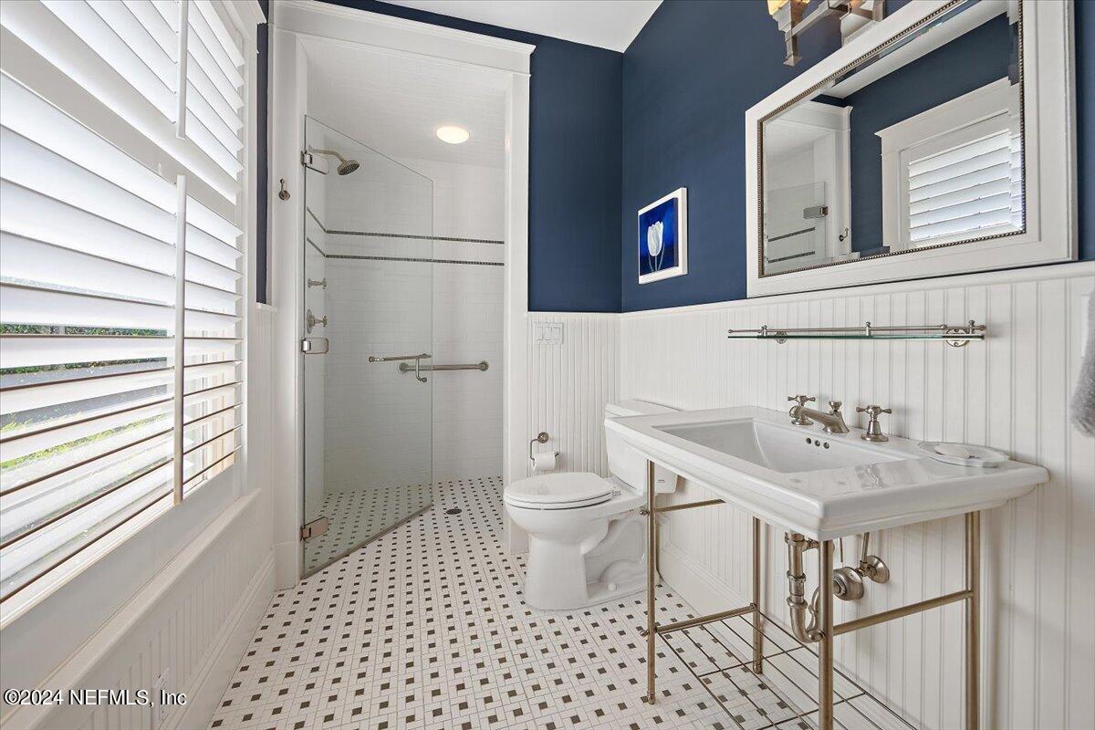 339 Pablo Road Ponte Vedra Beach, FL 32082 - Photo 16 of 44 a bathroom with a sink a toilet and shower