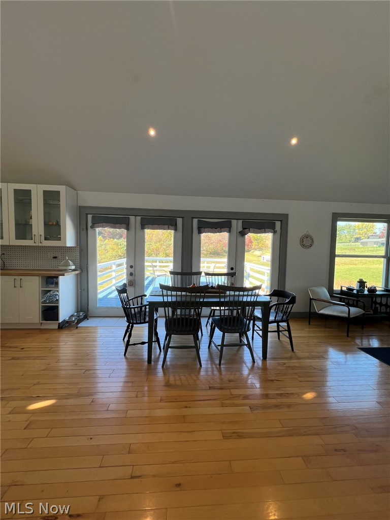 15393 Shade Road Guysville, OH 45735 - Photo 8 of 35 Spacious dining area with wood-finish flooring, recessed lighting, and multiple large windows