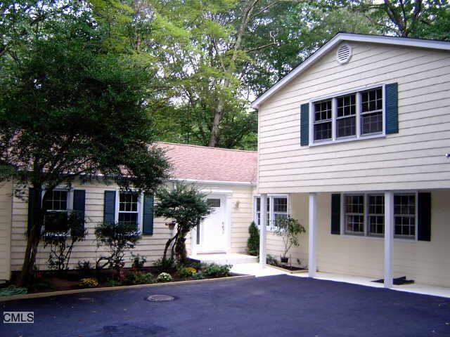 108 Sawmill Road Stamford, CT 06903 - Photo 1 of 1 a front view of a house with a yard