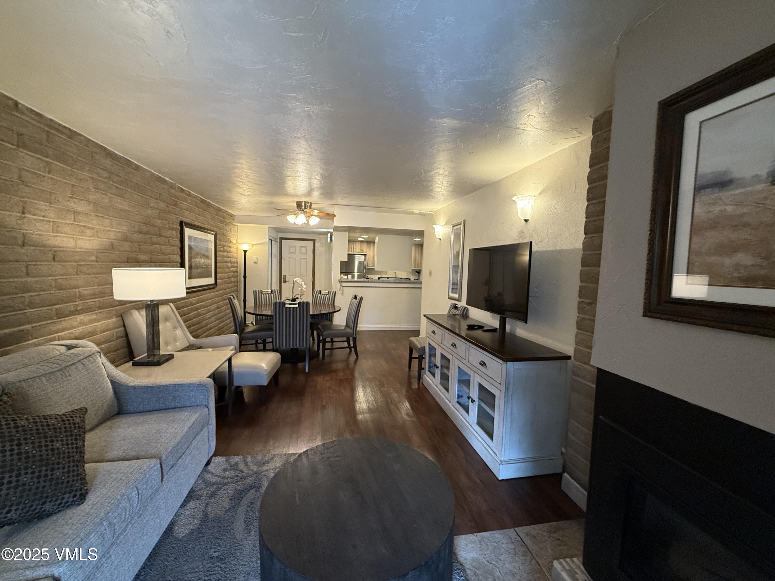 1020 Vail View Drive, Unit 130849 Vail, CO 81657 - Photo 5 of 20 a living room with furniture and a flat screen tv