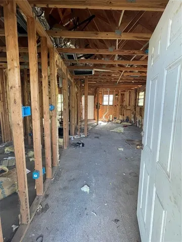 a view of empty room with wooden walls