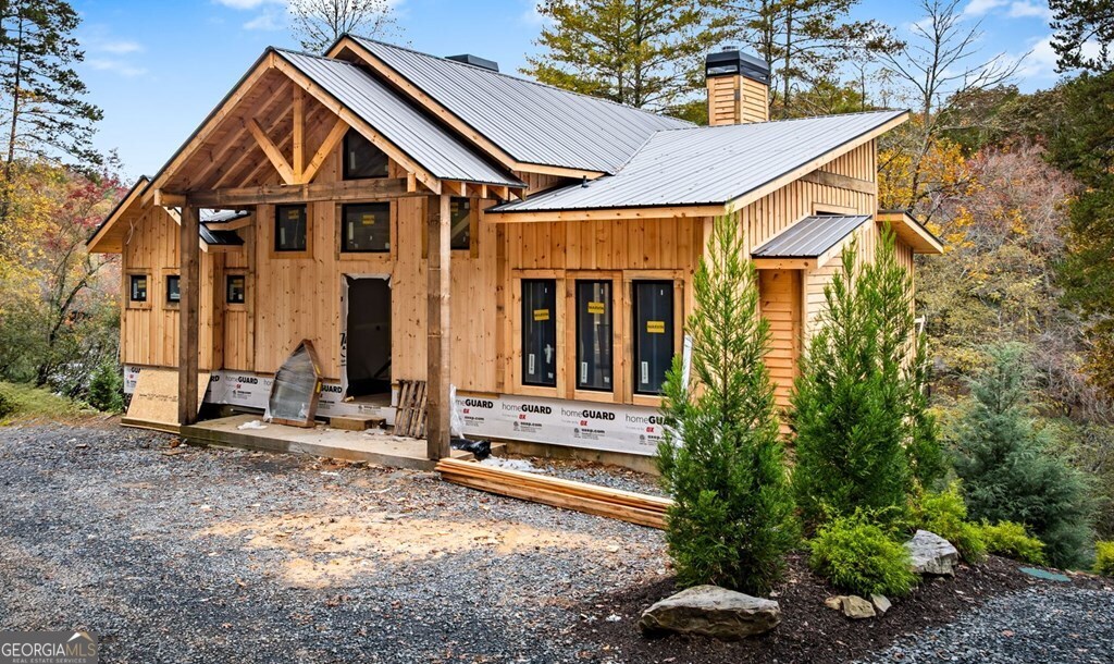 19 River Chase Way Mineral Bluff, GA 30559 - Photo 40 of 53 a front view of a house with garden