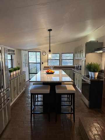 a view of a dining room with furniture and window