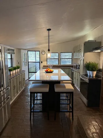 a view of a dining room with furniture and window
