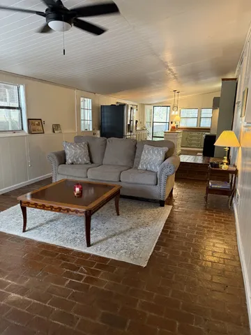 a living room with furniture and a rug