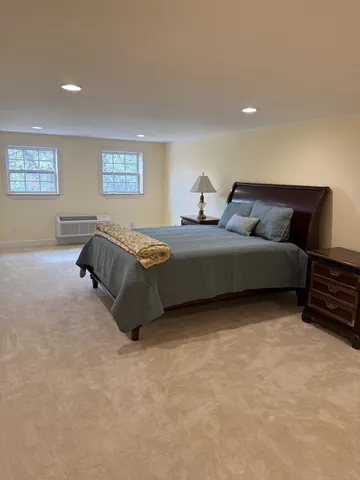 a bed room with furniture and a window