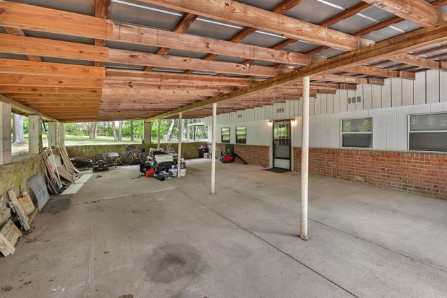 a view of parking garage with cars