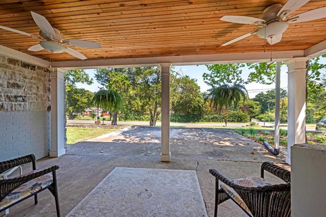 a view of a porch and garden