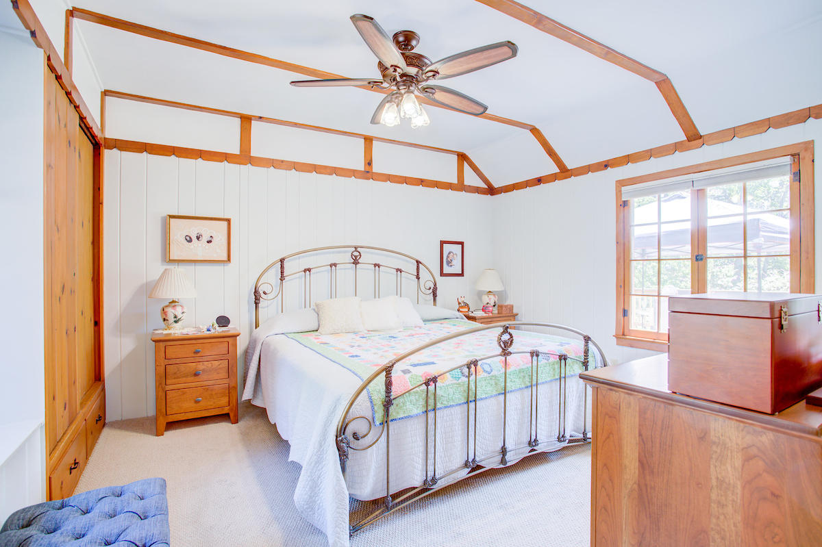 3184 Old Stage Road Central Point, OR 97502 - Photo 19 of 31 a bedroom with a bed next to a window with a chandelier