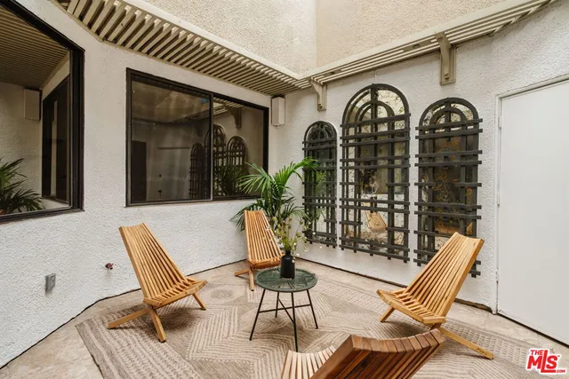 a view of a chairs and tables in the patio