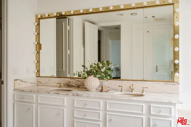 a bedroom with a bed and a desk