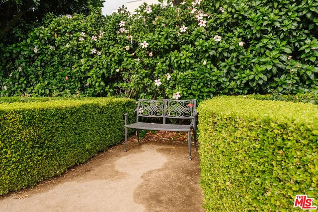 a bench sitting in the middle of a garden