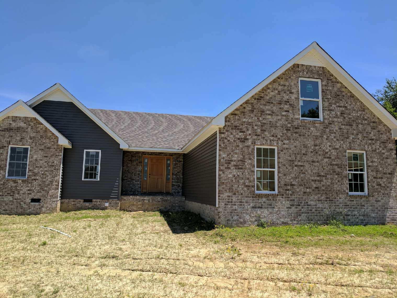 506 Corinth Road Portland, TN 37148 - Photo 1 of 4 a front view of a house with a yard