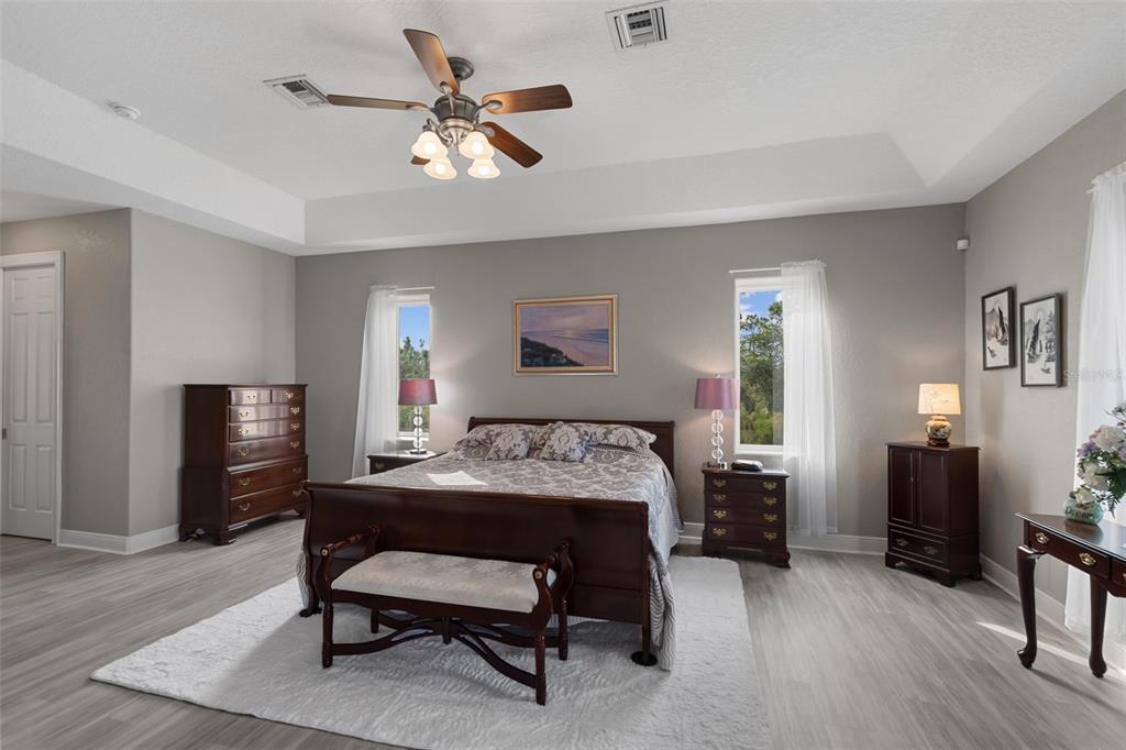 29336 Sam Way Punta Gorda, FL 33982 - Photo 14 of 44 a bedroom that has a bed and a table in it