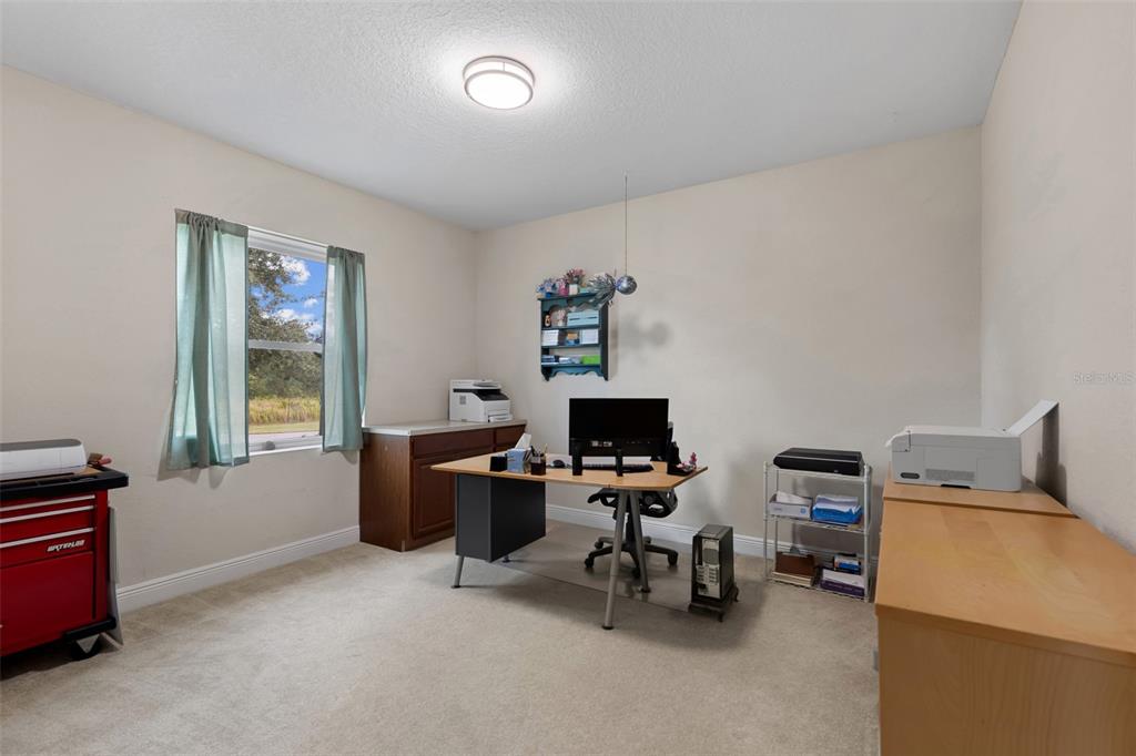 29336 Sam Way Punta Gorda, FL 33982 - Photo 24 of 44 a view of a workspace with furniture and a window