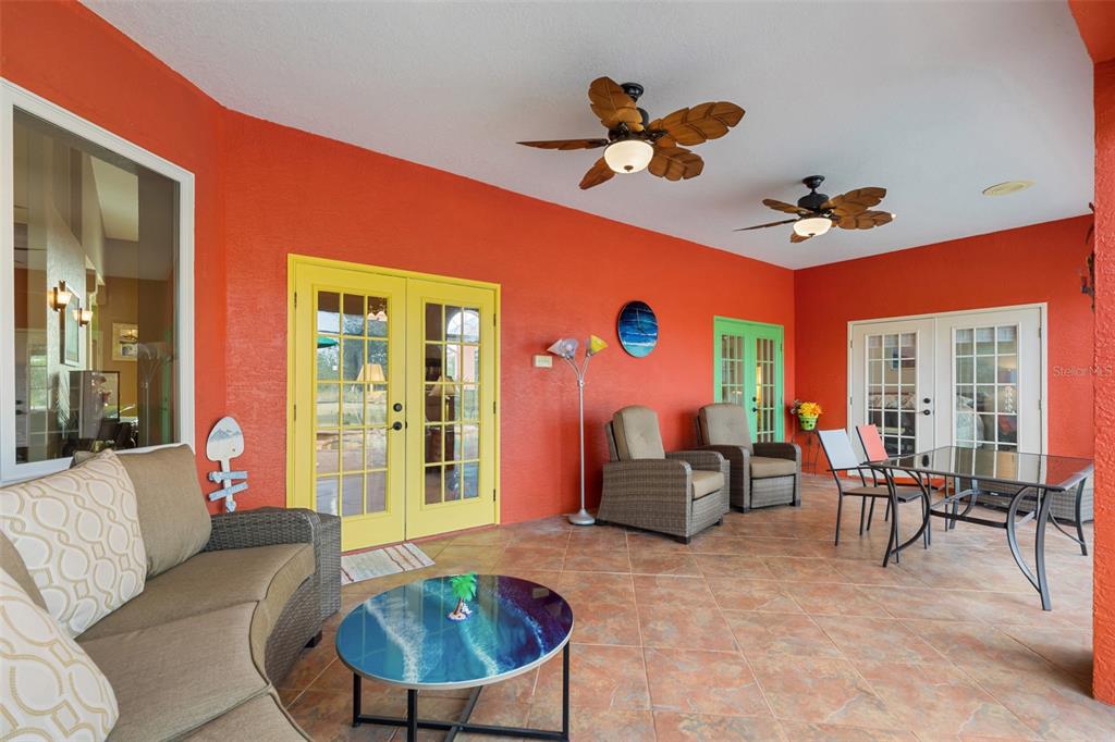 29336 Sam Way Punta Gorda, FL 33982 - Photo 27 of 44 a living room with furniture potted plant and a large window