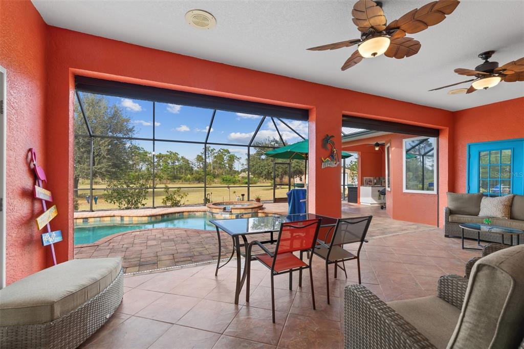 29336 Sam Way Punta Gorda, FL 33982 - Photo 28 of 44 a dining room with furniture and a floor to ceiling window