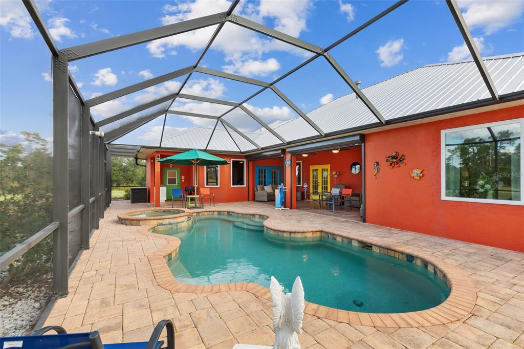 29336 Sam Way Punta Gorda, FL 33982 - Photo 30 of 44 a view of a swimming pool with a patio