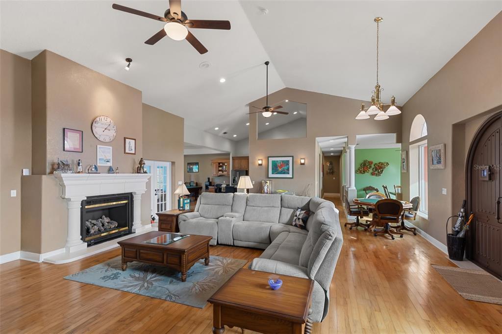 29336 Sam Way Punta Gorda, FL 33982 - Photo 3 of 44 a living room with furniture fireplace and a chandelier