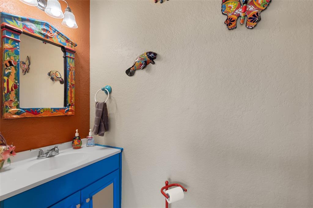 29336 Sam Way Punta Gorda, FL 33982 - Photo 31 of 44 a bathroom with a sink and a mirror