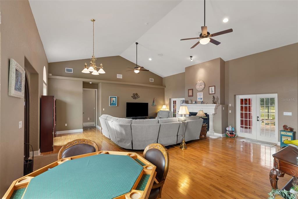 29336 Sam Way Punta Gorda, FL 33982 - Photo 5 of 44 a living room with furniture and a chandelier