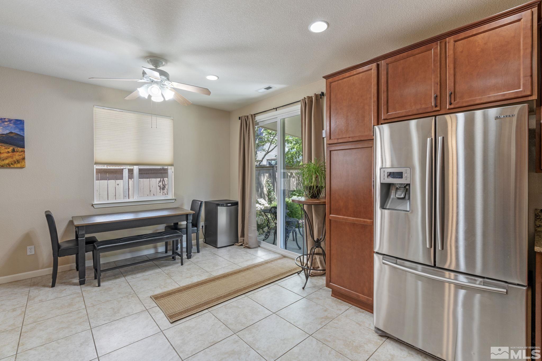 10848 Oakhaven Drive Reno, NV 89521 - Photo 17 of 32 a kitchen with stainless steel appliances granite countertop a refrigerator and a sink