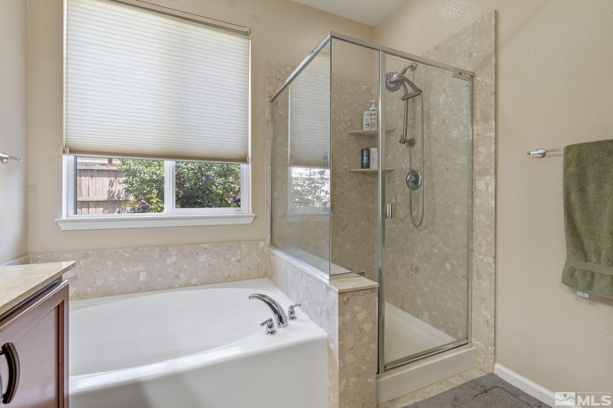 10848 Oakhaven Drive Reno, NV 89521 - Photo 22 of 32 a bathroom with a bathtub and a shower