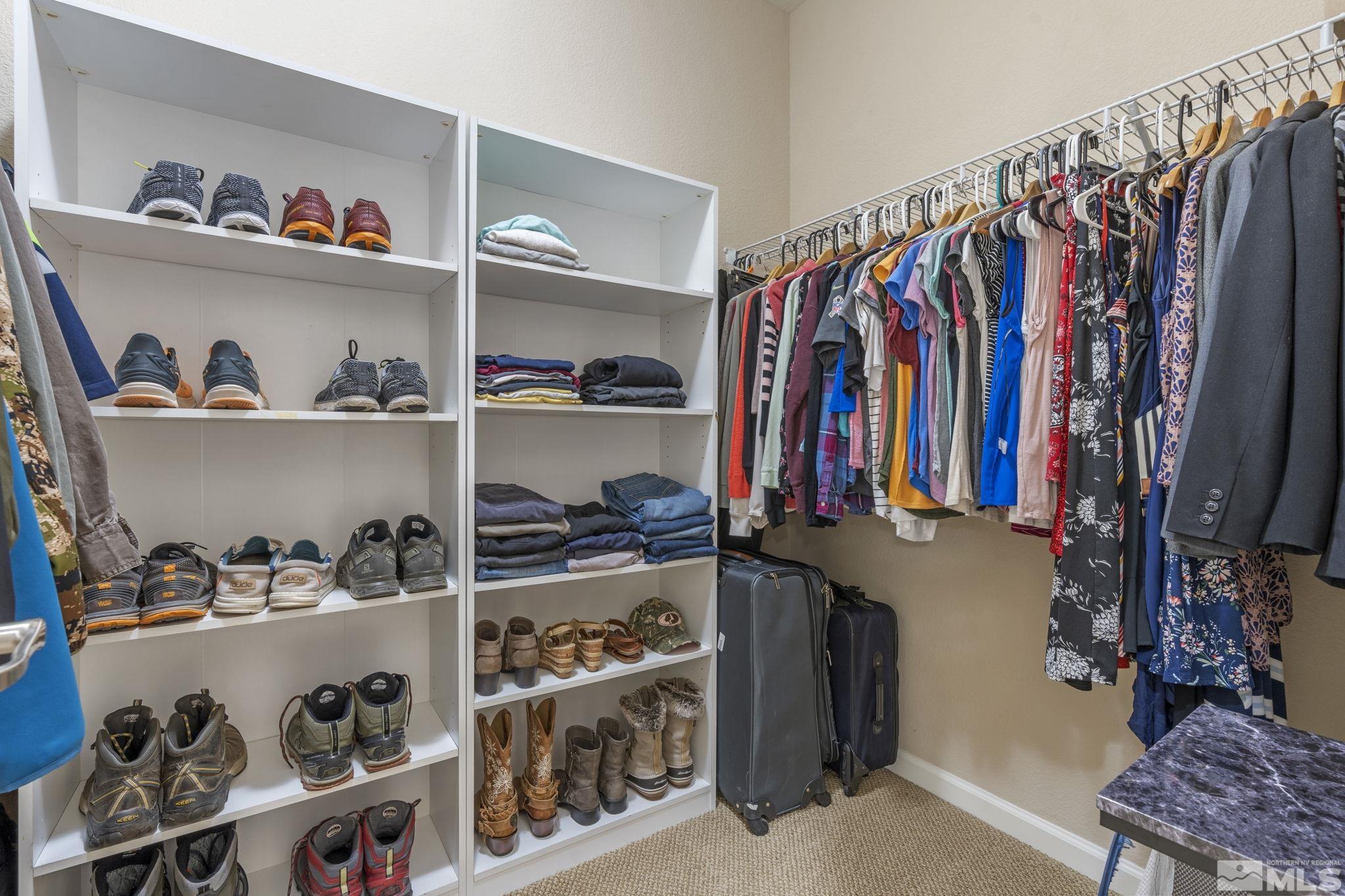 10848 Oakhaven Drive Reno, NV 89521 - Photo 23 of 32 a view of walk in closet with clothes and shoes