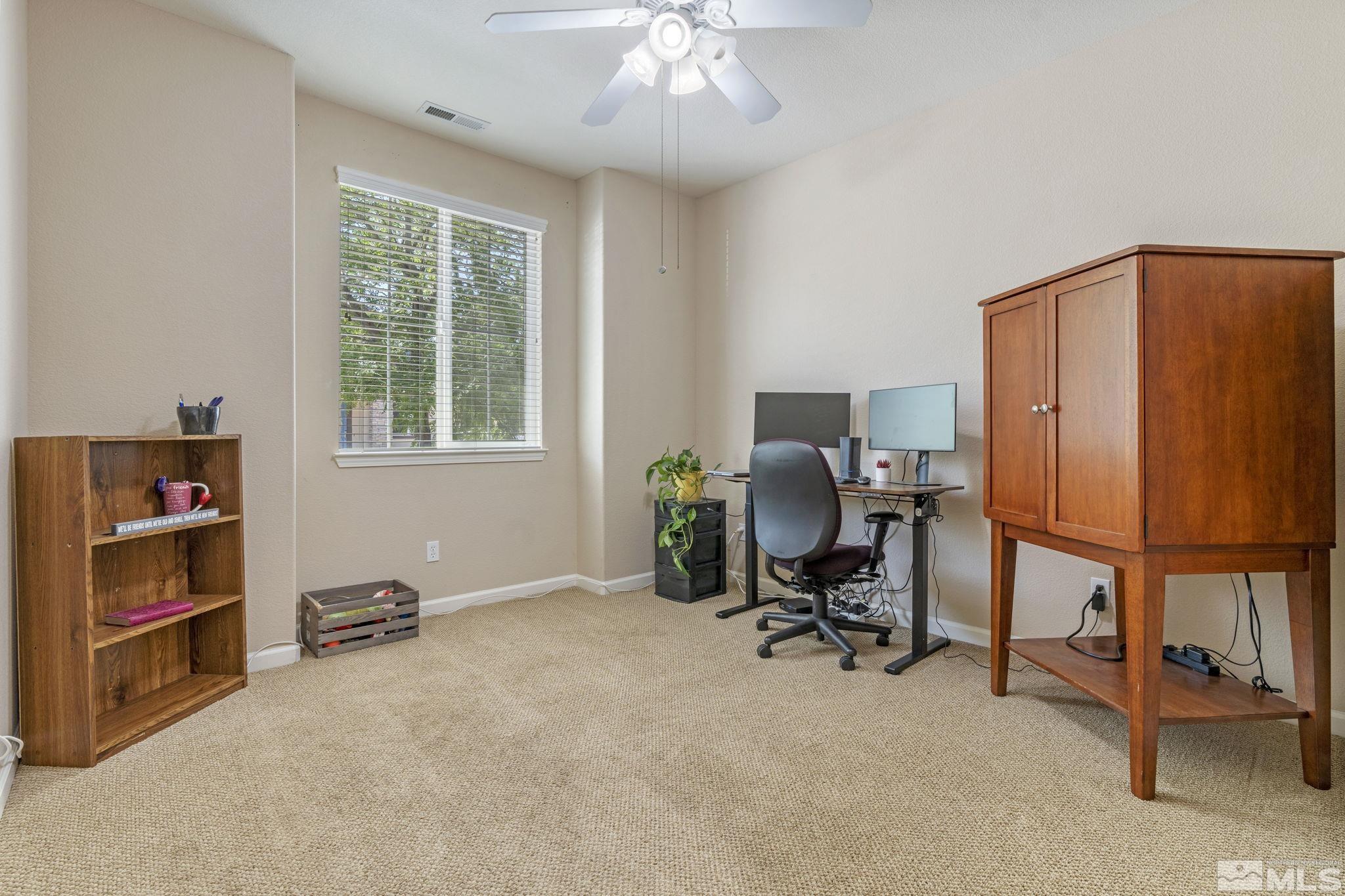 10848 Oakhaven Drive Reno, NV 89521 - Photo 25 of 32 a view of a workspace with furniture and a workspace