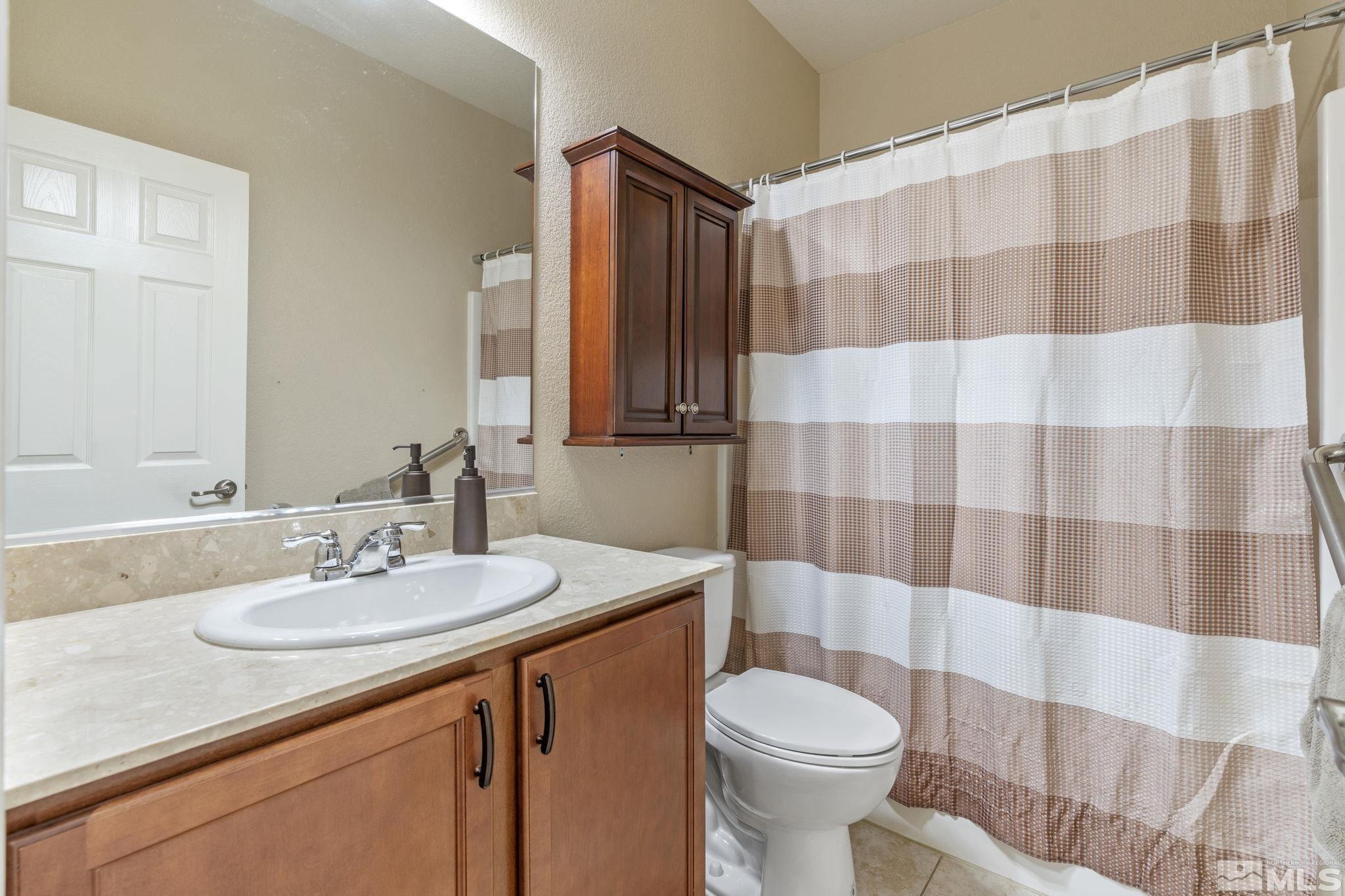 10848 Oakhaven Drive Reno, NV 89521 - Photo 26 of 32 a bathroom with a sink and toilet