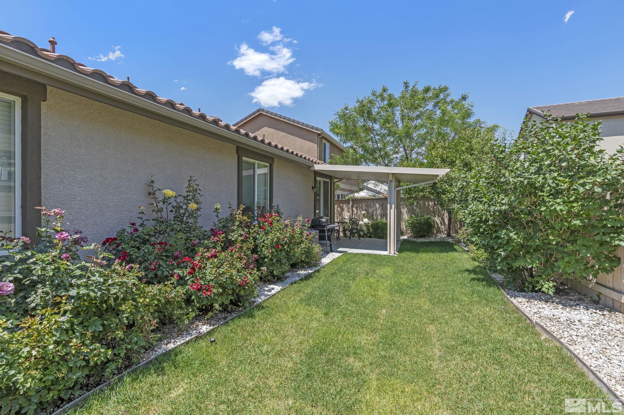10848 Oakhaven Drive Reno, NV 89521 - Photo 30 of 32 a front view of a house with a yard