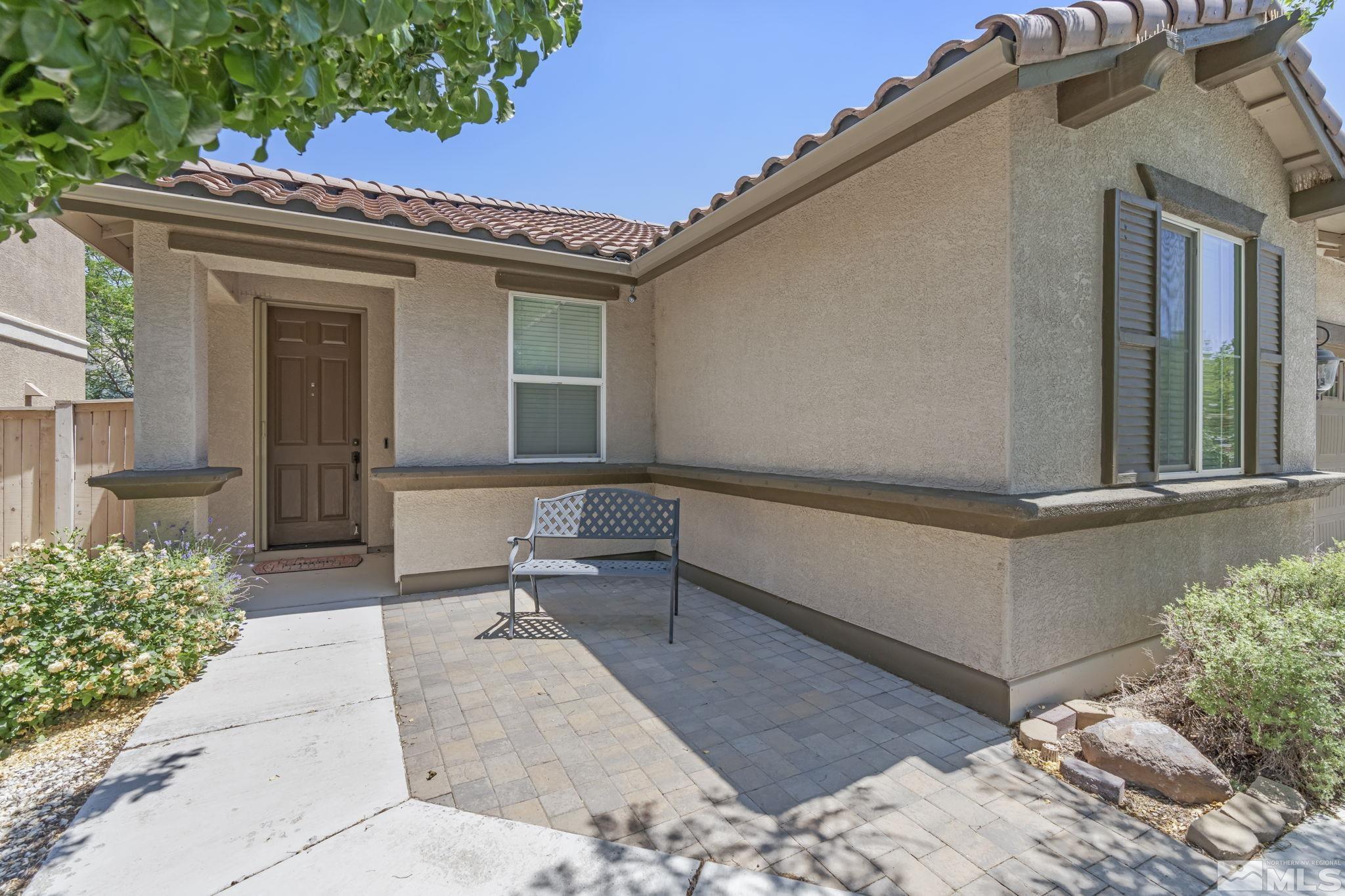 10848 Oakhaven Drive Reno, NV 89521 - Photo 4 of 32 a building outdoor space with patio furniture