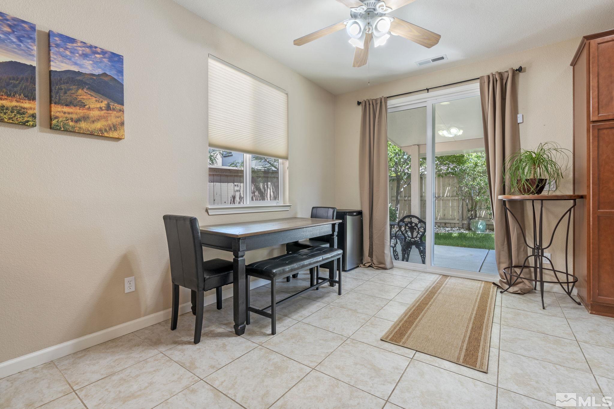10848 Oakhaven Drive Reno, NV 89521 - Photo 9 of 32 a view of a dining room with furniture window and outside view