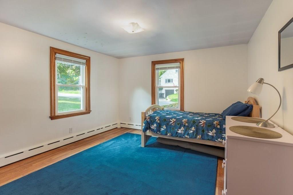 28 Pershing Avenue Framingham, MA 01702 - Photo 11 of 22 a bedroom with a bed and window